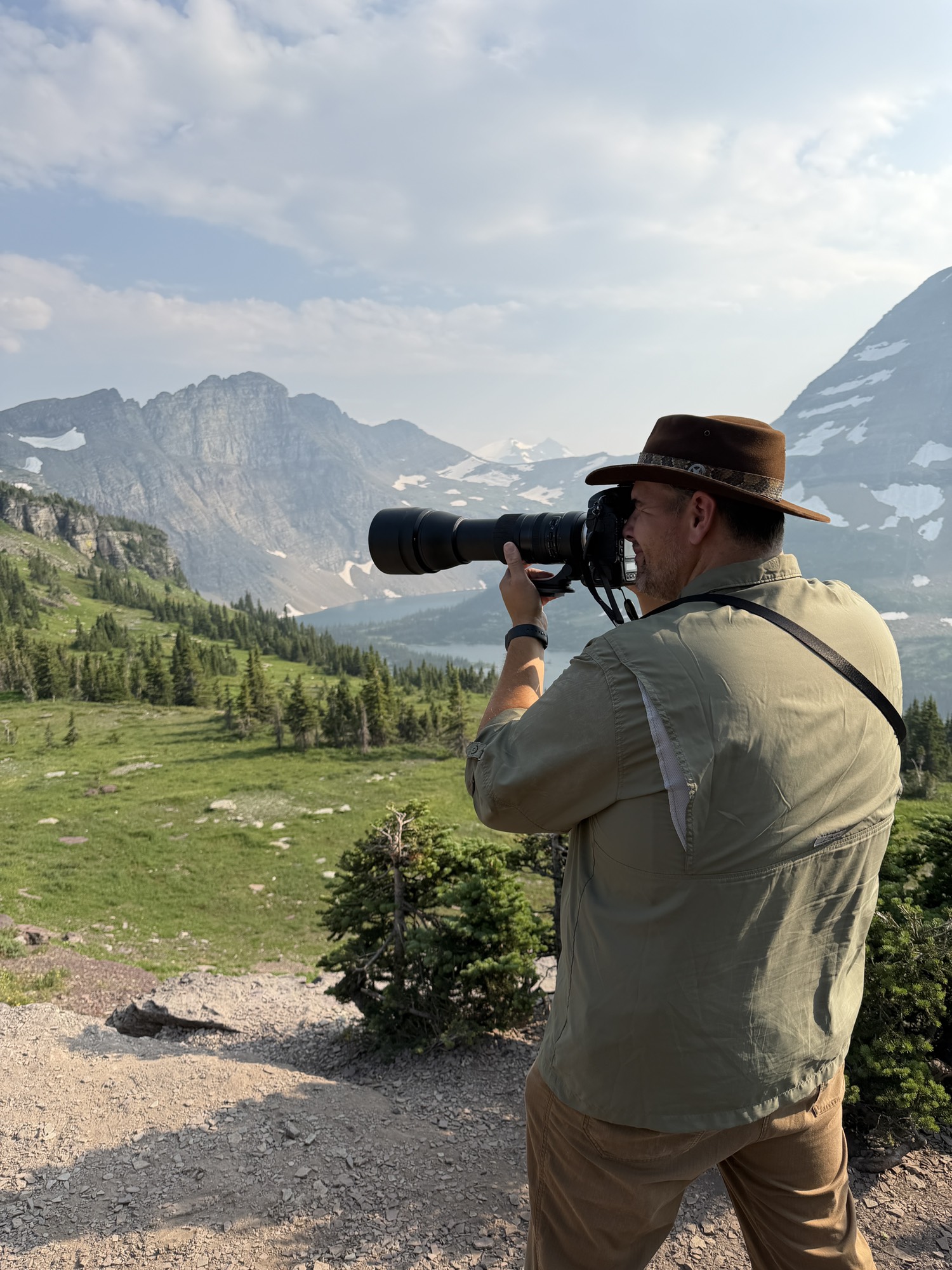 Photographer capturing wildlife in the mountains